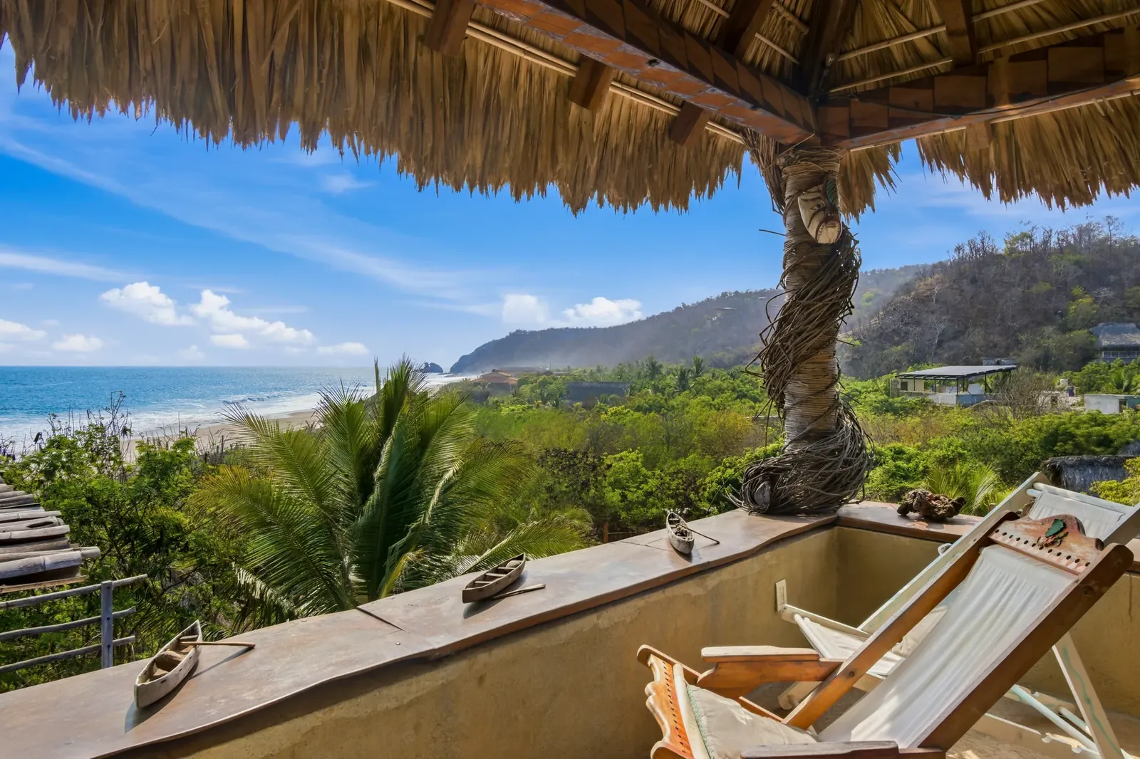 Private terrace with deckchairs and panoramic beach views